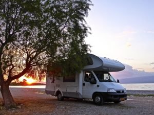 Motorhome on the beach at sunset